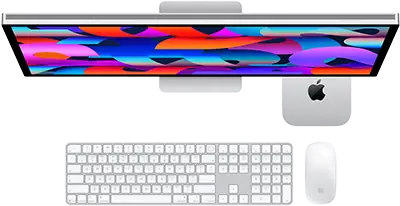 Mac mini glissé sous un Studio Display, Magic Keyboard avec pavé numérique, Magic Mouse
