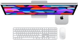 Mac mini glissé sous un Studio Display, Magic Keyboard avec pavé numérique, Magic Mouse