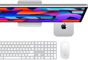 Mac mini glissé sous un Studio Display, Magic Keyboard avec pavé numérique, Magic Mouse